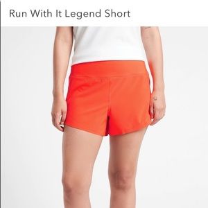 Athleta Run With It 3.5” neon orange short